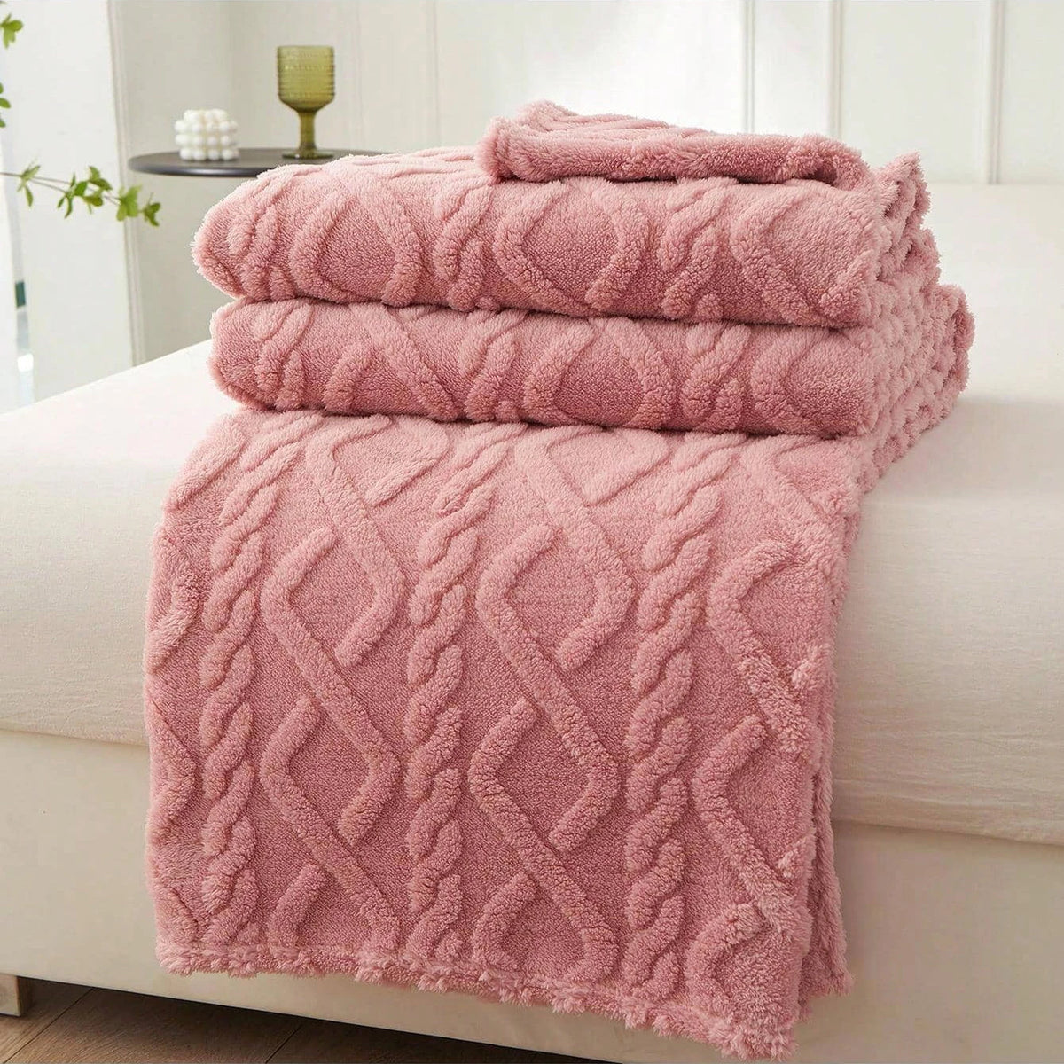 Pink Featherweight Throw with a raised geometric texture.