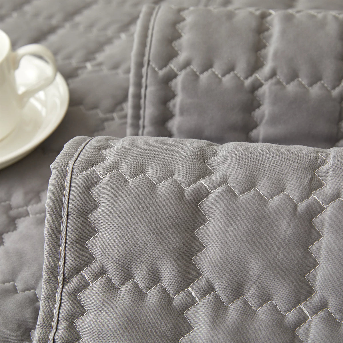 Close-up of the bound edge and quilted stitching