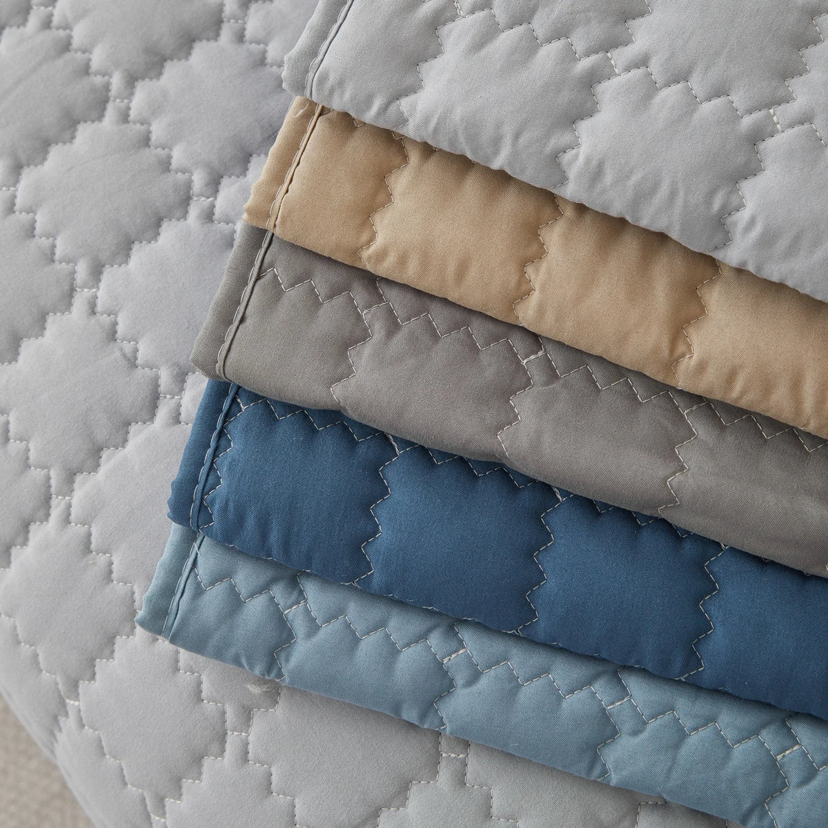 Stacked sofa panels in light grey, sand, dark grey, deep blue, and sky blue