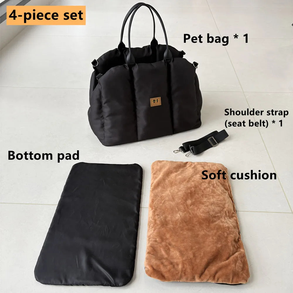 Black four-piece pet carrier set with strap, base pad, and cushion