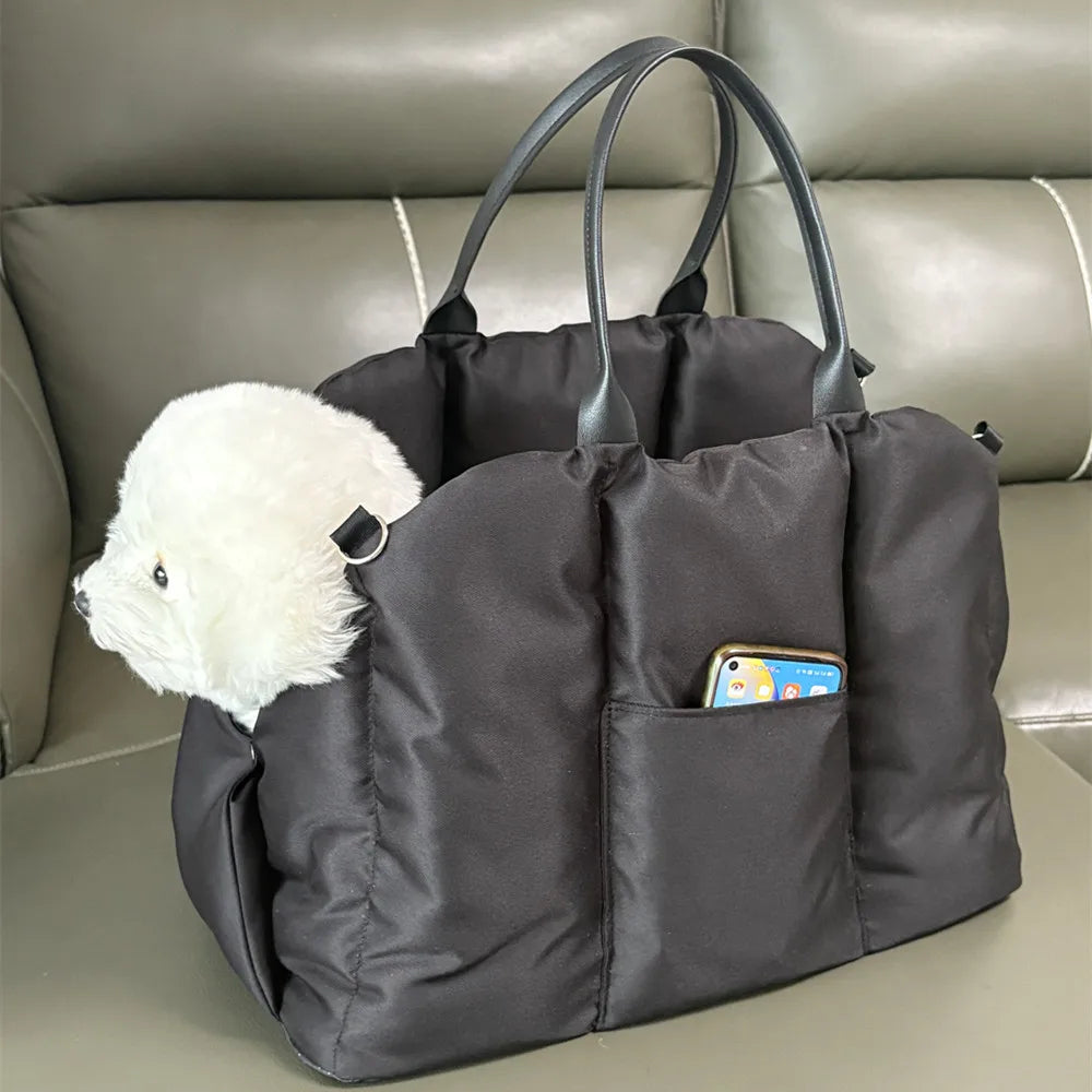 Black Convertible Nest pet carrier with a small dog and exterior pocket