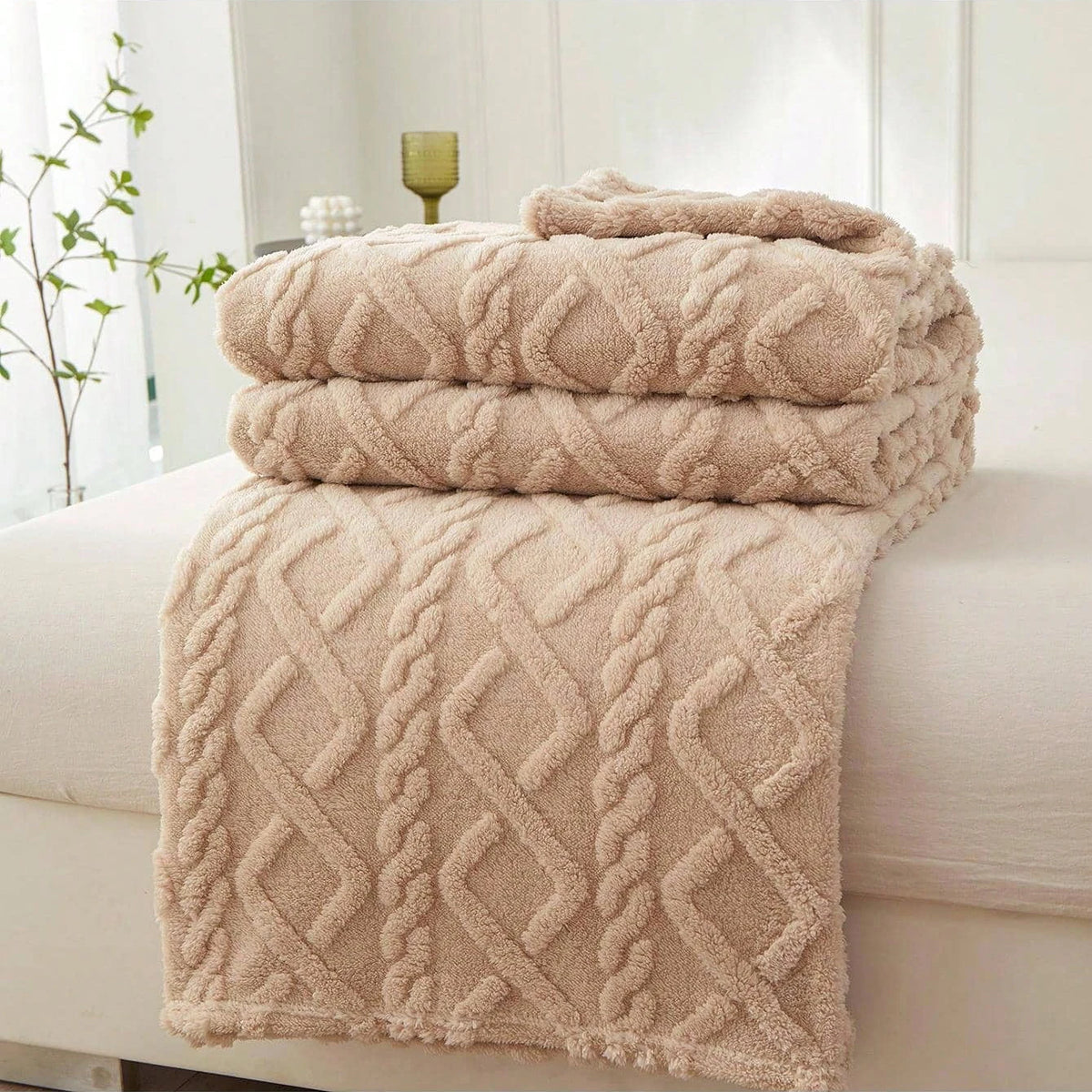 Khaki Featherweight Throw with a raised geometric texture.